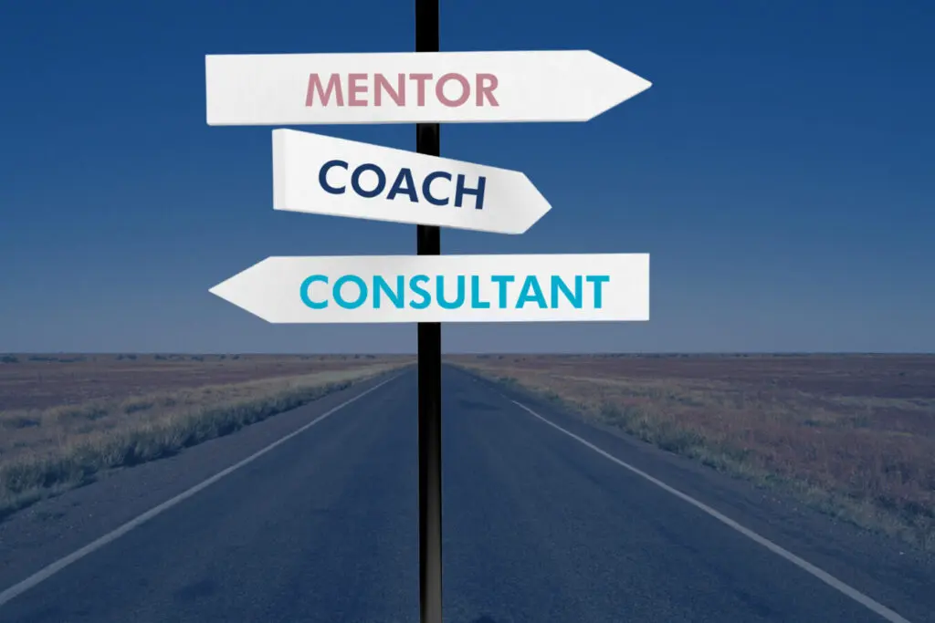 3 Road signs with the words Mentor, Coach and Consultant