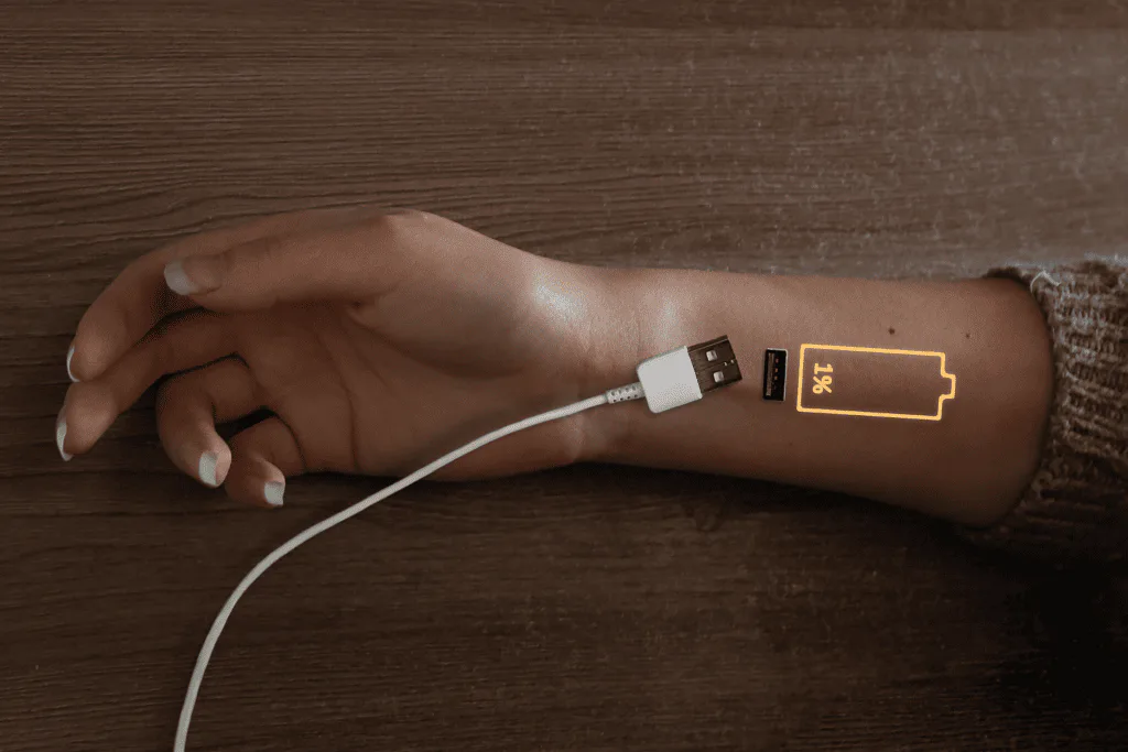 USB cable charging an arm low on battery
